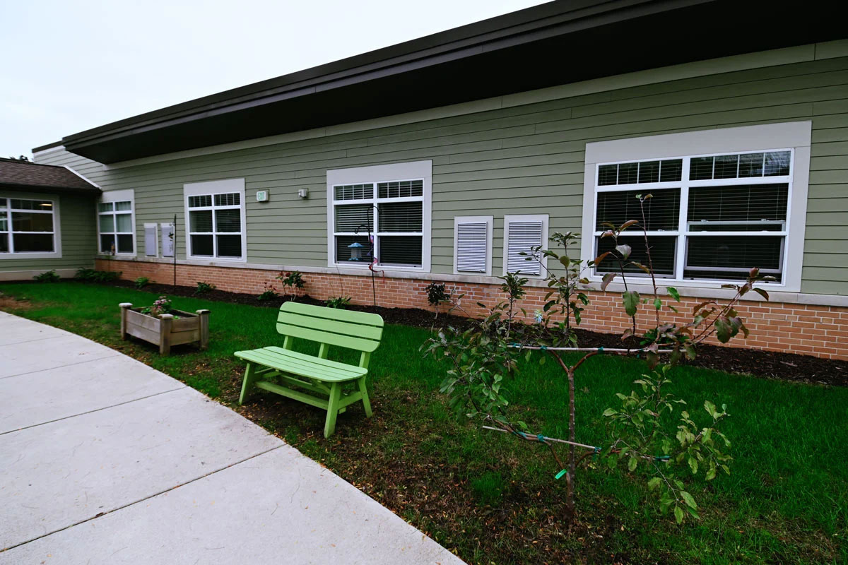 exterior with benches and flowers