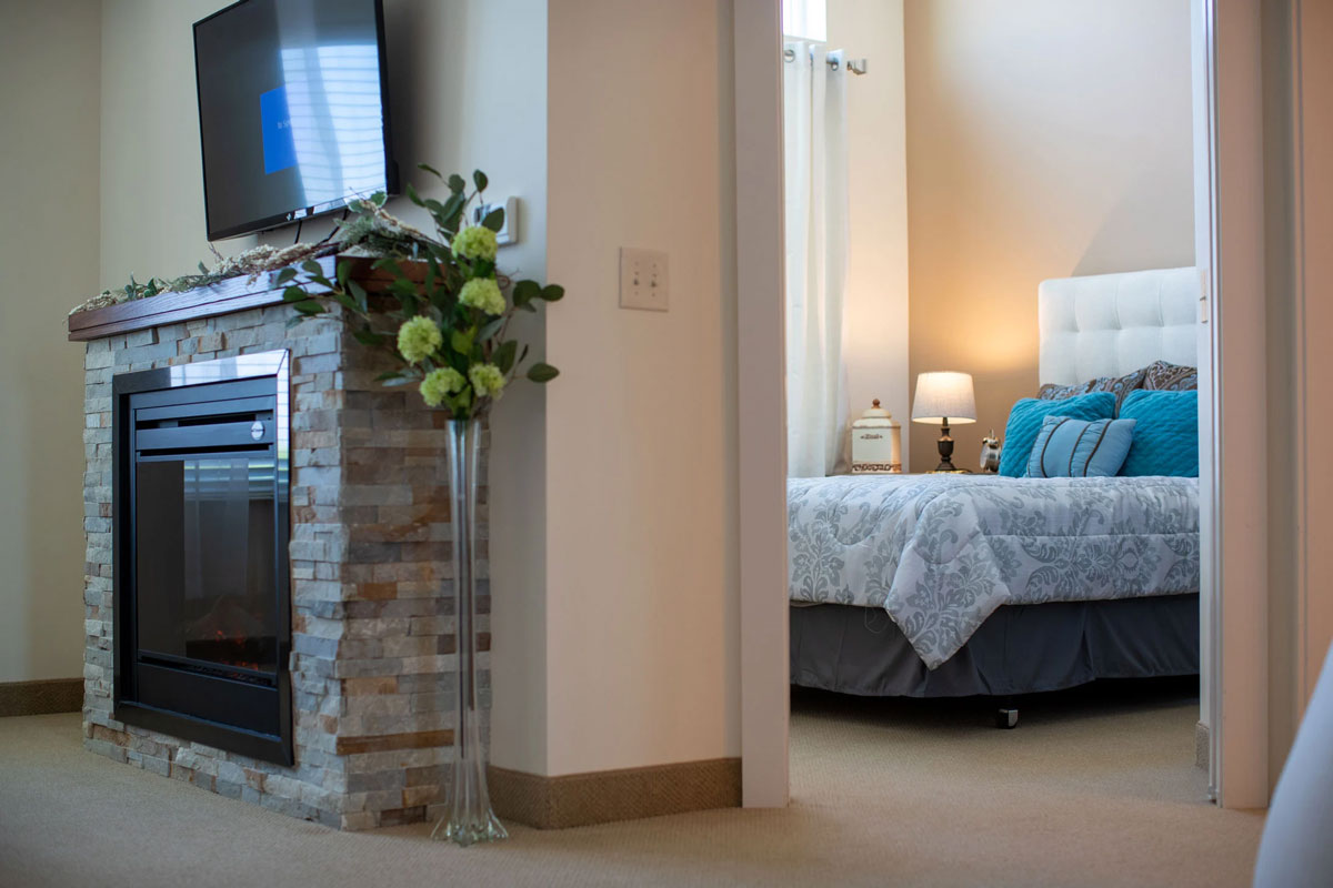 resident fireplace and bedroom entry